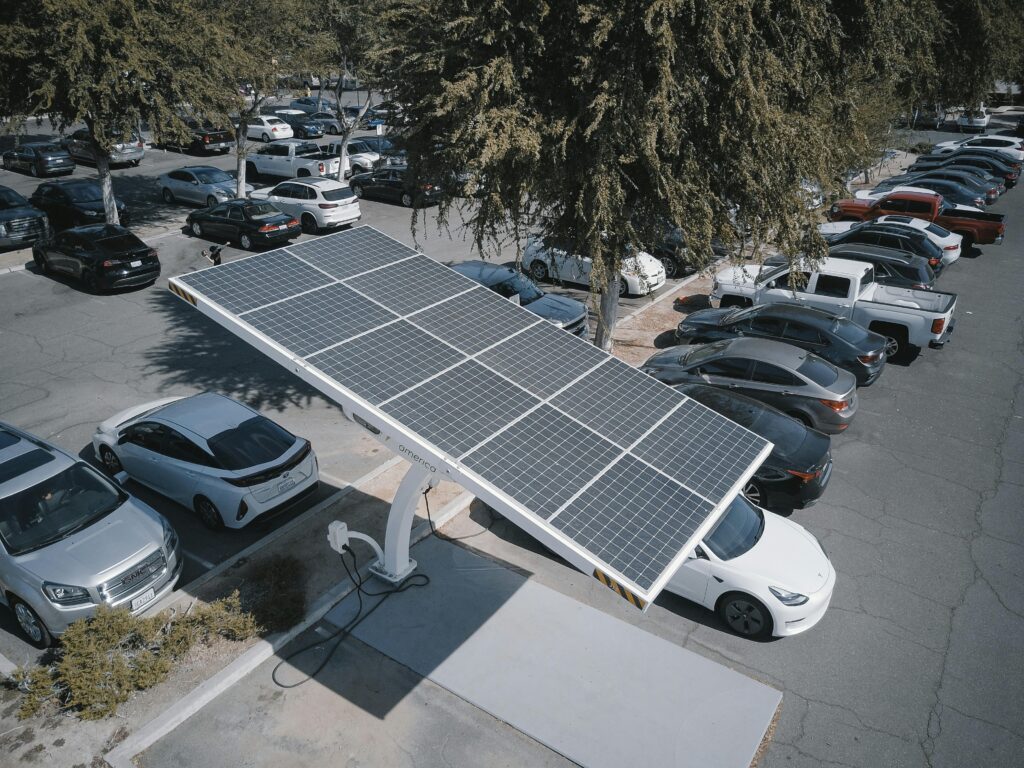 AI-driven green tech USA 2025 tariff crisis savings with EV charging."
