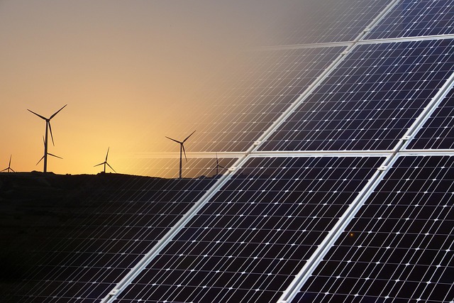 An image showing solar panels or wind turbines with digital overlay elements representing AI/machine learning. AI green technology USA 2025 optimizing renewable energy systems with smart grid management